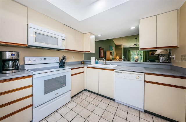 kitchen with white cabinetry, sink, ceiling fan, white appliances, and light tile patterned flooring