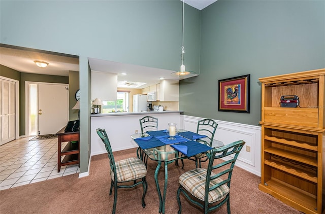 dining room with light carpet