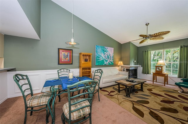 carpeted living room featuring ceiling fan and lofted ceiling