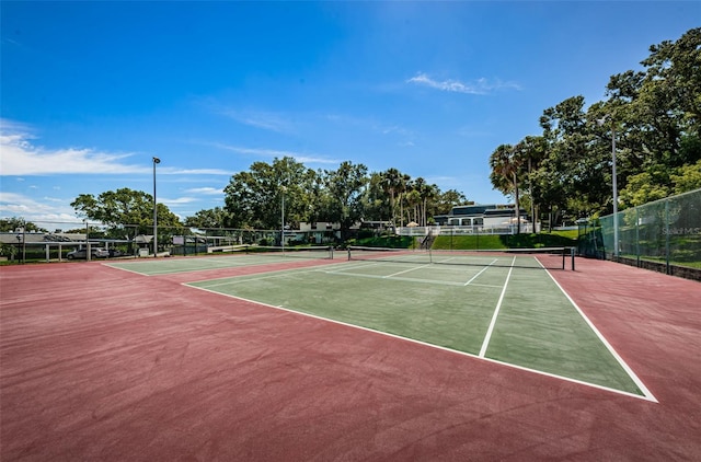 view of sport court with basketball hoop