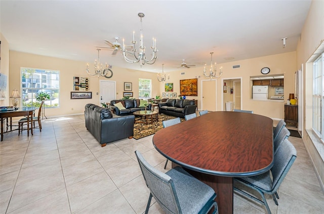 dining space featuring ceiling fan, light tile patterned floors, and a wealth of natural light