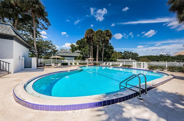 view of swimming pool featuring a patio