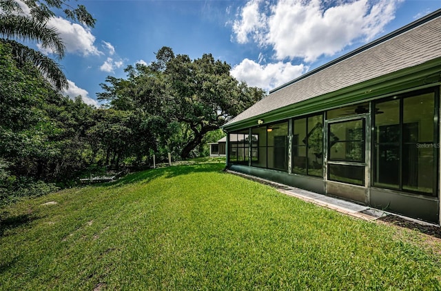 view of yard featuring a sunroom