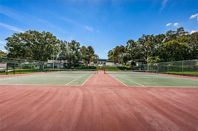 view of tennis court featuring basketball court