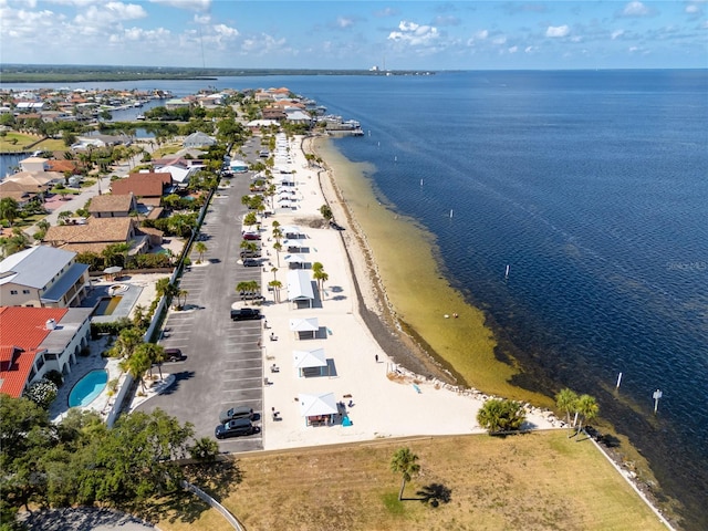 aerial view with a water view and a view of the beach