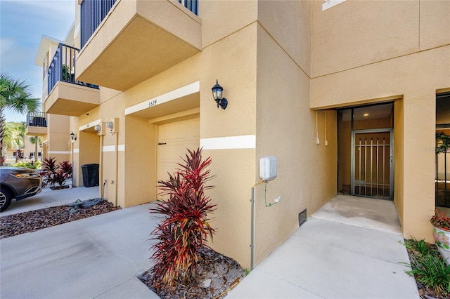 view of exterior entry featuring a garage