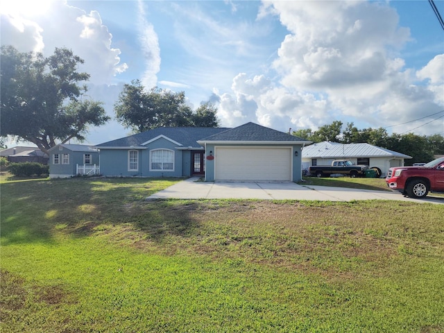 ranch-style house featuring a garage and a front lawn