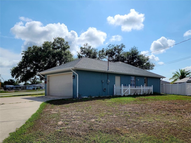 view of property exterior featuring a garage