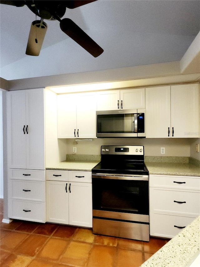 kitchen with ceiling fan, white cabinetry, and appliances with stainless steel finishes