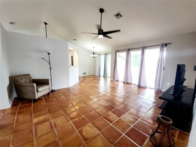 unfurnished living room with tile patterned flooring, ceiling fan, and vaulted ceiling