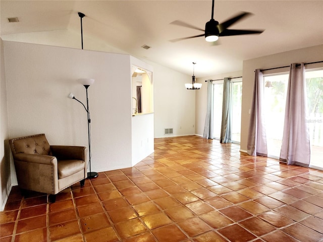 unfurnished room featuring tile patterned floors, vaulted ceiling, and ceiling fan