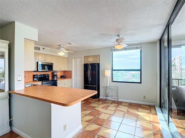 kitchen featuring tasteful backsplash, black appliances, light tile patterned floors, ceiling fan, and kitchen peninsula