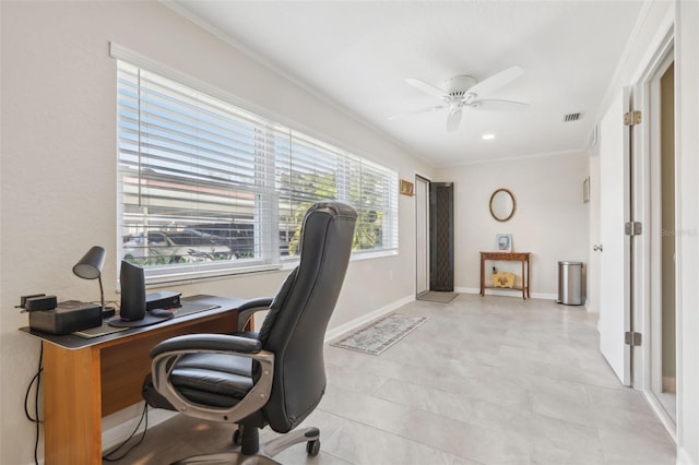 office space with ceiling fan and ornamental molding