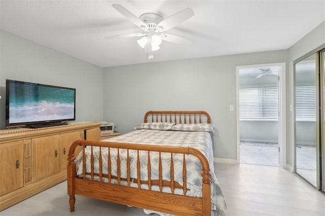 bedroom with ceiling fan and light hardwood / wood-style flooring