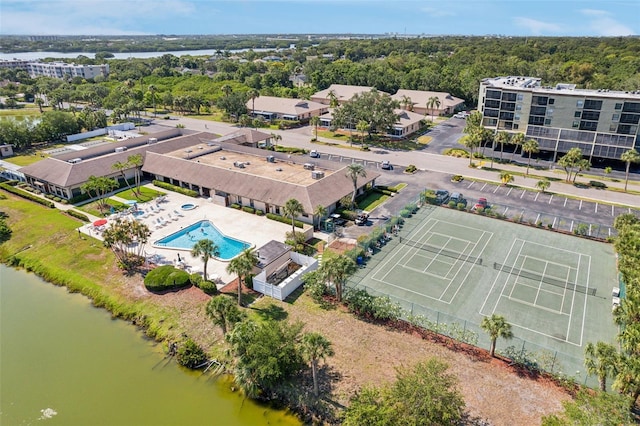 birds eye view of property with a water view