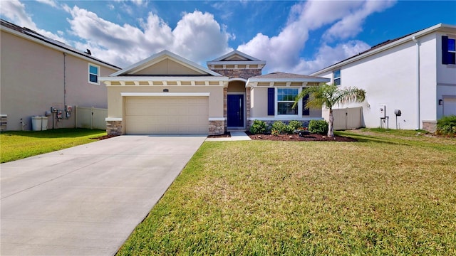 view of front of home featuring a garage and a front lawn