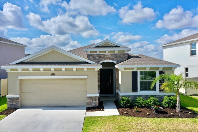 view of front of house featuring a garage and a front lawn