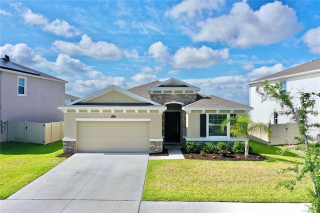 view of front of home featuring a garage, a front yard, and solar panels