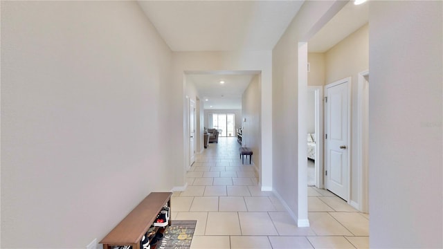 corridor with light tile floors