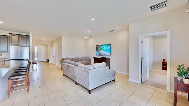 living room featuring light tile flooring