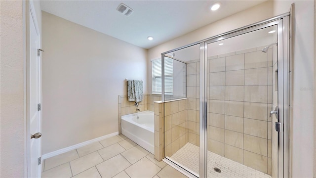 bathroom with tile flooring and plus walk in shower