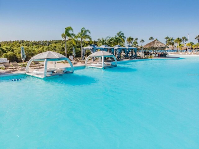 view of swimming pool featuring a water slide and a gazebo