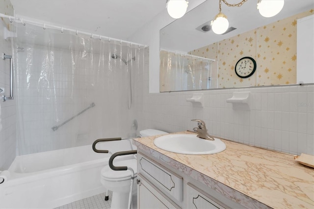 full bathroom with tile floors, oversized vanity, toilet, and tile walls