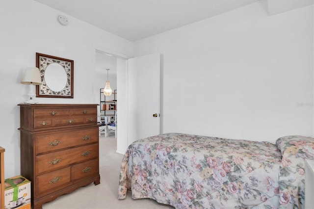 bedroom featuring light colored carpet