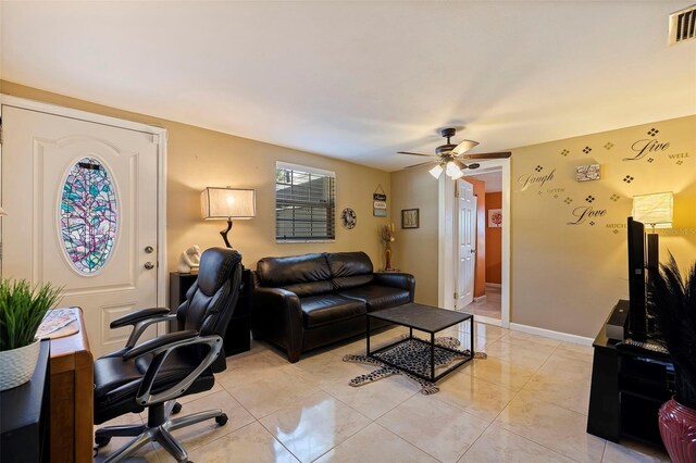 living room featuring ceiling fan and light tile patterned floors