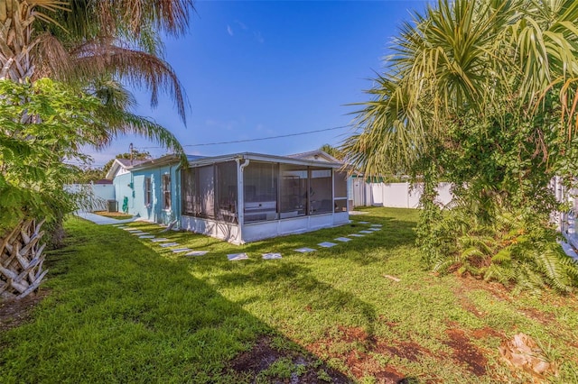 view of yard with a sunroom