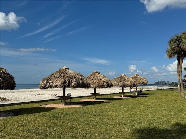 view of community featuring a yard and a water view