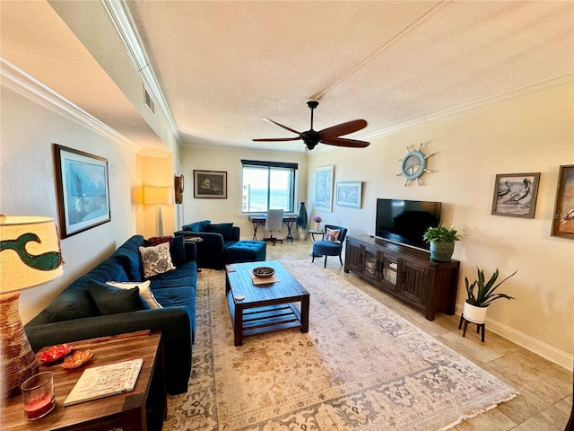 living room with a textured ceiling, ceiling fan, crown molding, and tile patterned floors