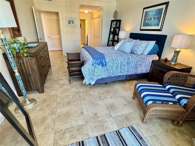 bedroom with a closet and ornamental molding