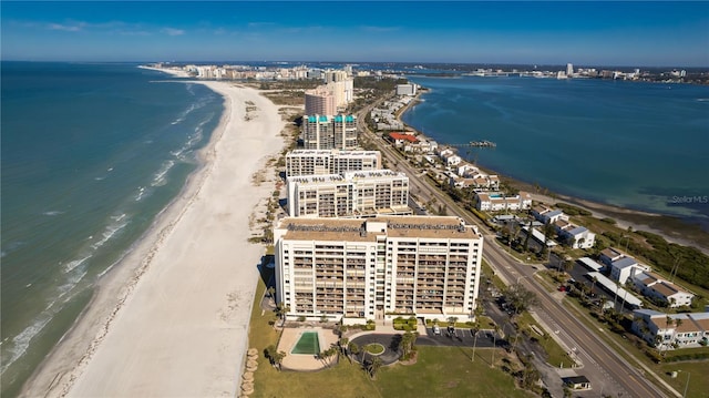 birds eye view of property featuring a water view and a view of the beach