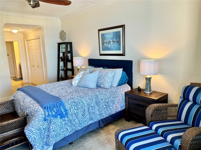 bedroom with ceiling fan, a closet, and ornamental molding