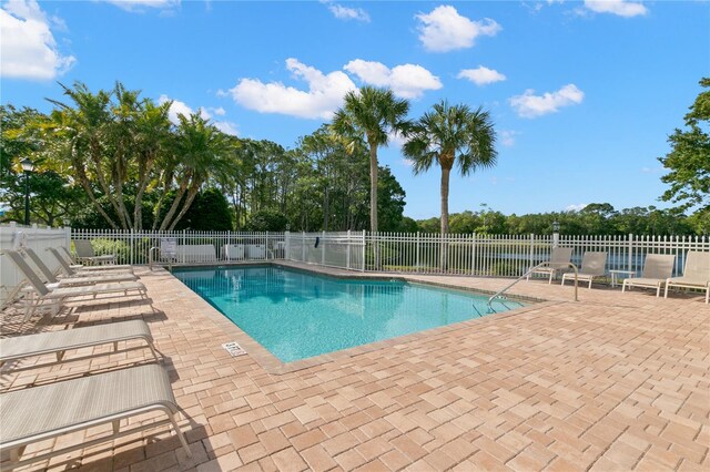 view of swimming pool featuring a patio area