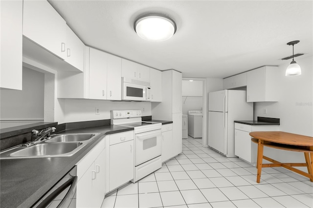 kitchen featuring sink, white appliances, white cabinets, and hanging light fixtures