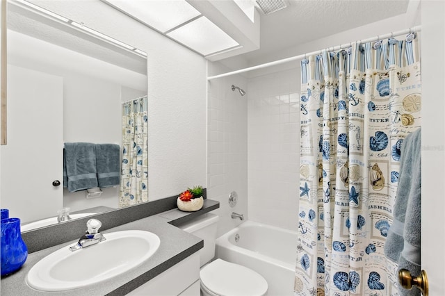 full bath with shower / bath combination with curtain, visible vents, vanity, and toilet