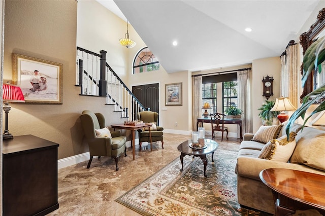 interior space with baseboards, high vaulted ceiling, recessed lighting, and stairway