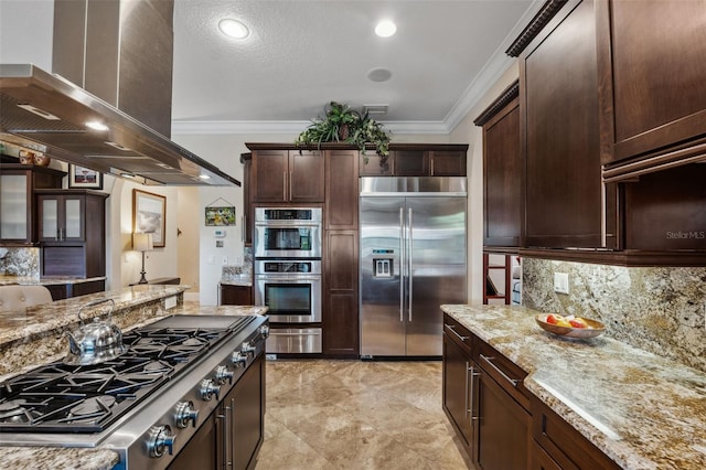 kitchen with crown molding, stainless steel appliances, island exhaust hood, and a warming drawer