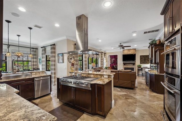 kitchen featuring crown molding, island range hood, dark brown cabinetry, stainless steel appliances, and visible vents