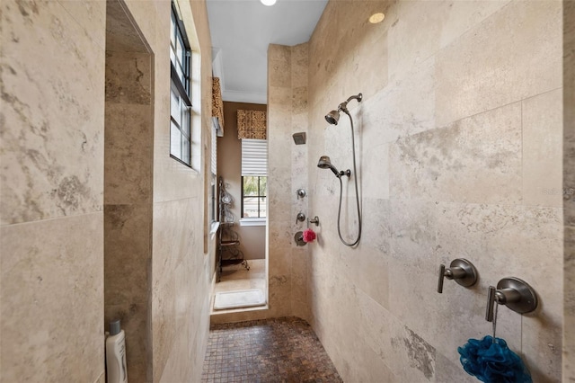 full bathroom featuring crown molding and tiled shower