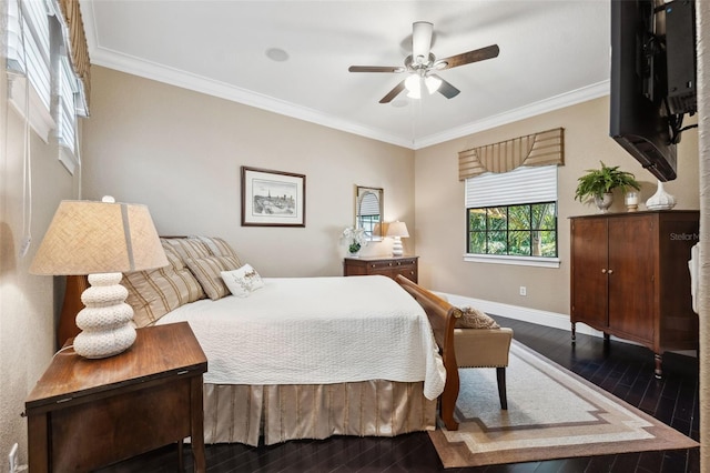 bedroom with baseboards, crown molding, dark wood-style floors, and ceiling fan
