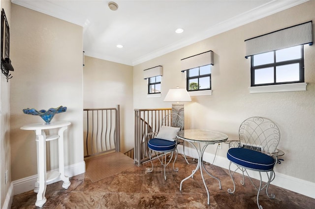 sitting room with recessed lighting, crown molding, baseboards, and an upstairs landing