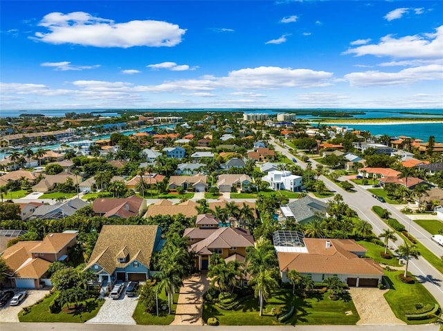 birds eye view of property with a residential view and a water view