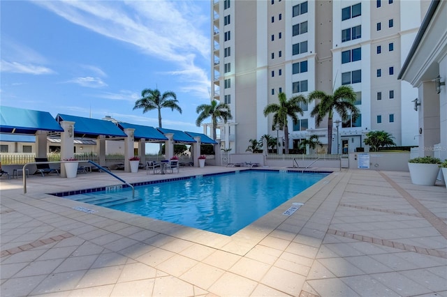 view of swimming pool with a patio area