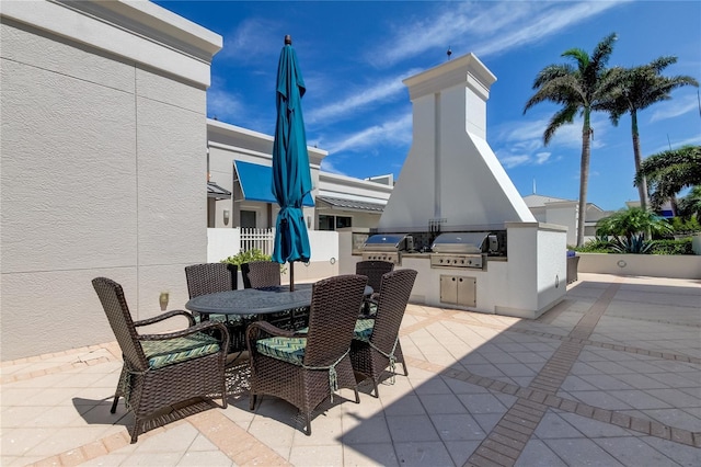 view of patio / terrace featuring a grill and an outdoor kitchen