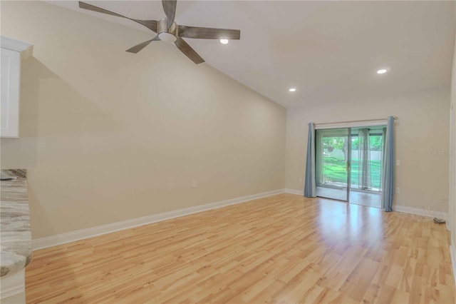 interior space featuring ceiling fan, light hardwood / wood-style floors, and vaulted ceiling