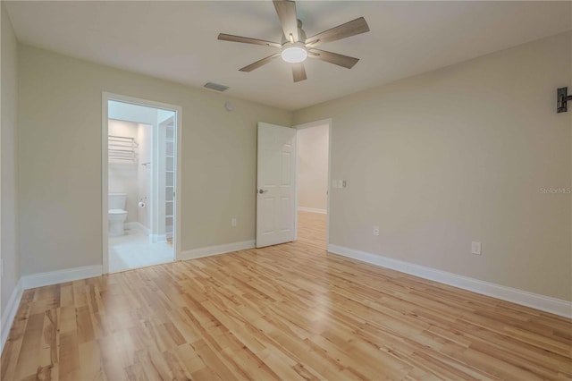 unfurnished room with ceiling fan and light hardwood / wood-style flooring