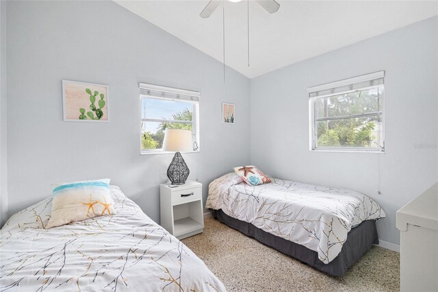 carpeted bedroom featuring ceiling fan and lofted ceiling